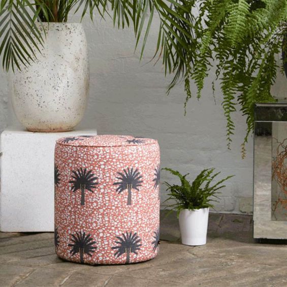 Striking tropical design pouffe with batik fabric and copper finish