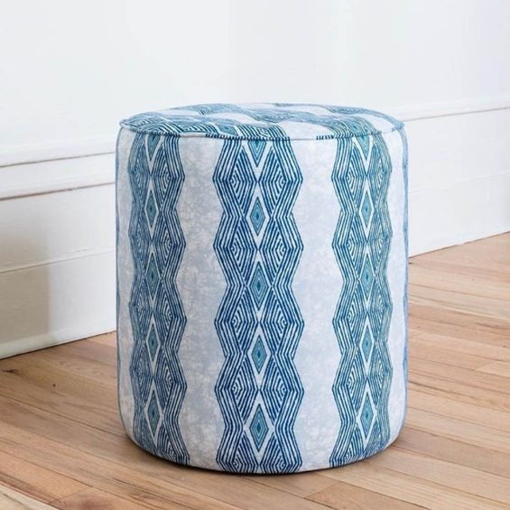 Elegant indigo patterned pouffe with quilted seat 