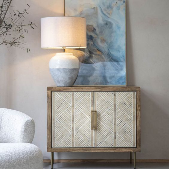 stunning natural toned two-door cabinet with bone tiled doors