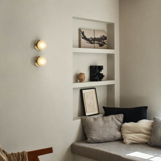 Charming brass wall light with round shade