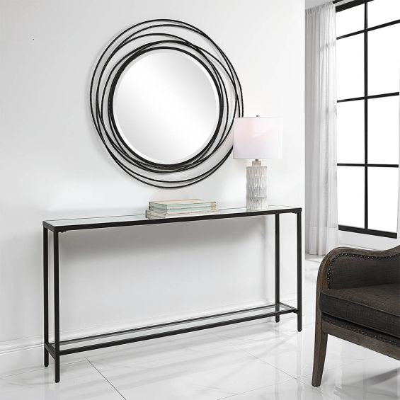 Sleek black metal console table with glass top