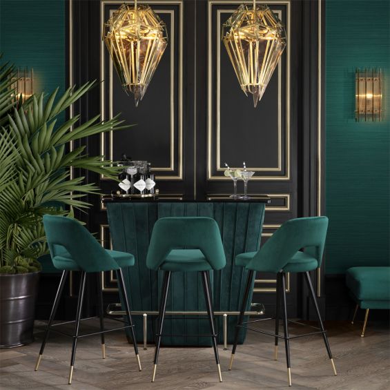 Luxurious modern dark green velvet counter stools by Eichholtz