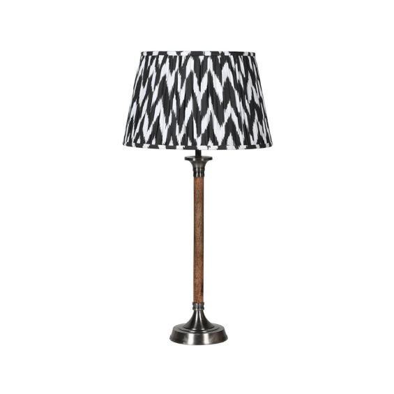 Monochrome patterned lamp shade with wooden stand and metal base