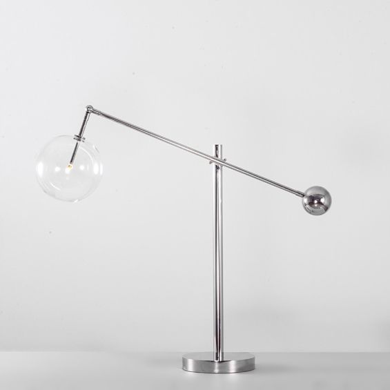 Industrial table lamp with clear glass globe lampshade in a polished nickel finish made from solid brass