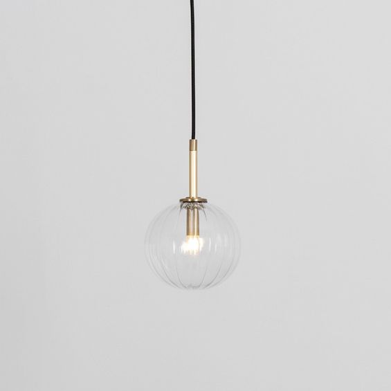 Textured clear glass globe pendant ceiling light with natural brass fixture