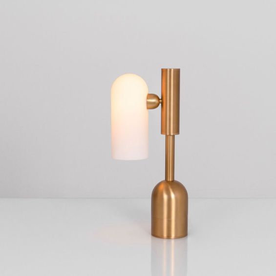 An elegant lacquered burnished brass table lamp with triplex opal glass