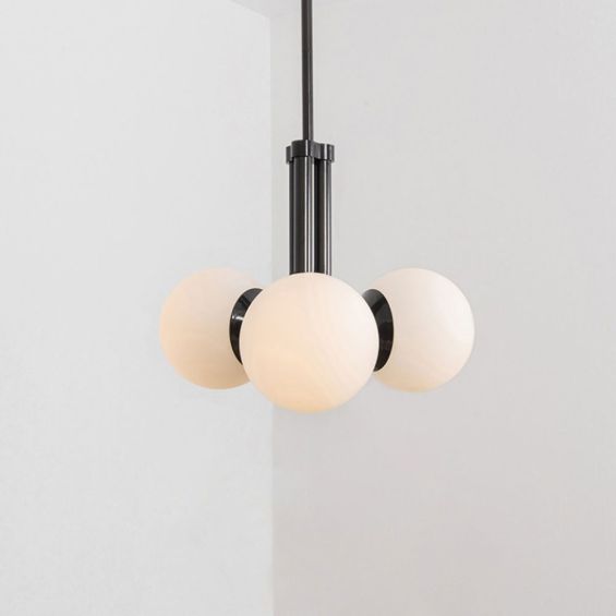 A chic, early century inspired LED pendant with translucent opal globes