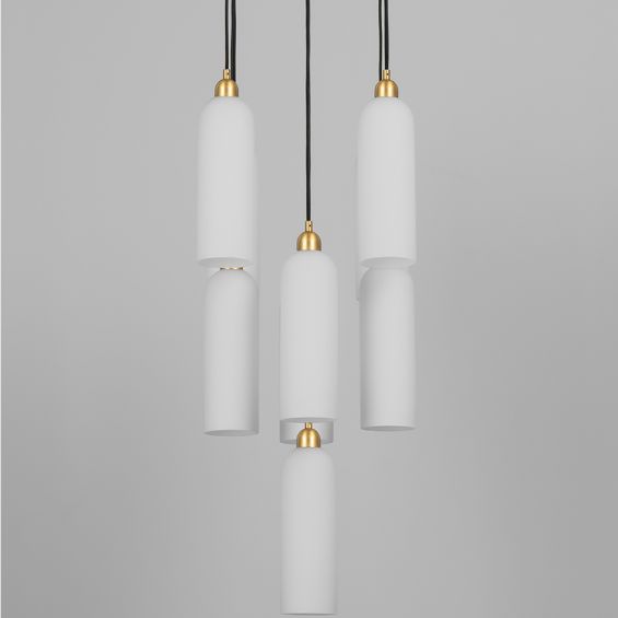 A luxury chandelier by Schwung with 9 frosted, opal glass shades and a stunning solid brass finish 