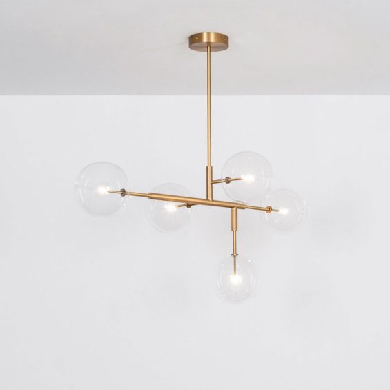 A luxurious lacquered burnished brass LED pendant with transparent glass lampshades