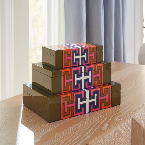 A vibrant box by Jonathan Adler with a geometric pattern and blue velvet lining