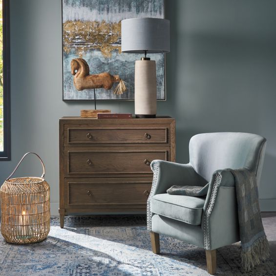 A stylish minimalist oak and plywood three drawer chest of drawers with brass handles