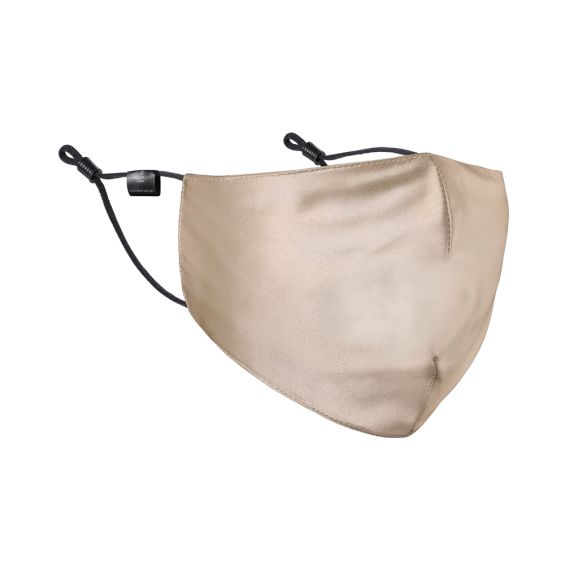 A luxurious beige coloured face mask with black straps
