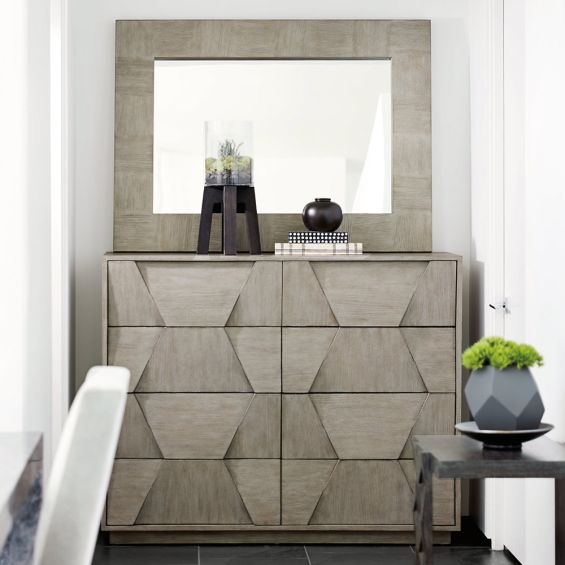 A luxurious and sophisticated eight drawer dresser with a unique dimensional design 