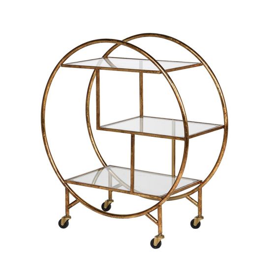 an antiqued round gold drinks trolley with glass shelves 