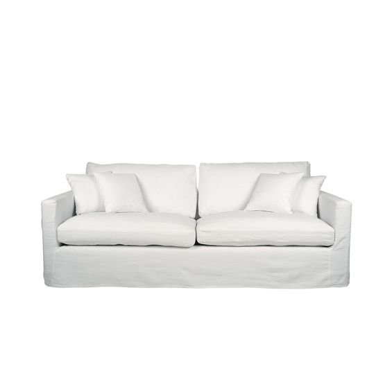 A modern white linen sofa with removable cover