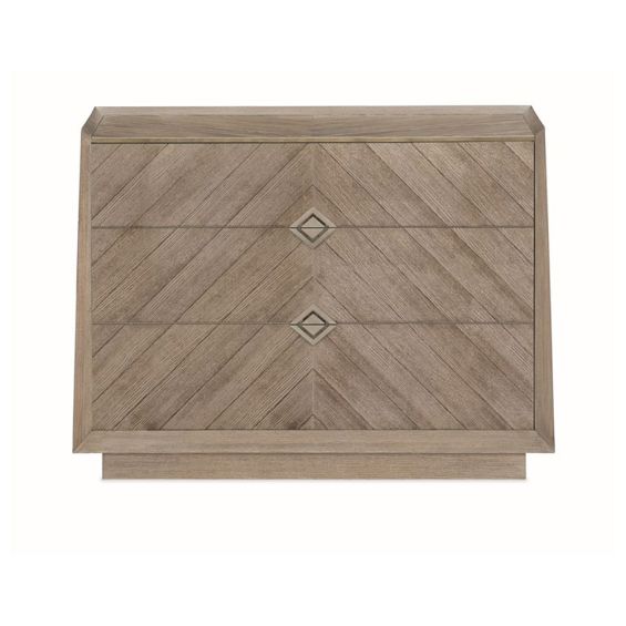 Sophisticated bedside table with chevron detailing and dark gold diamond handles. 