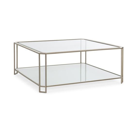 A modern coffee table with a minimal design featuring a glamorous gold frame and beautiful bevelled glass edges