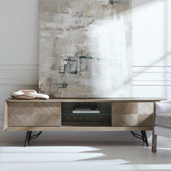 A statement entertainment unit by Caracole with diamond veneer patterns and a gorgeous patterned back panel 