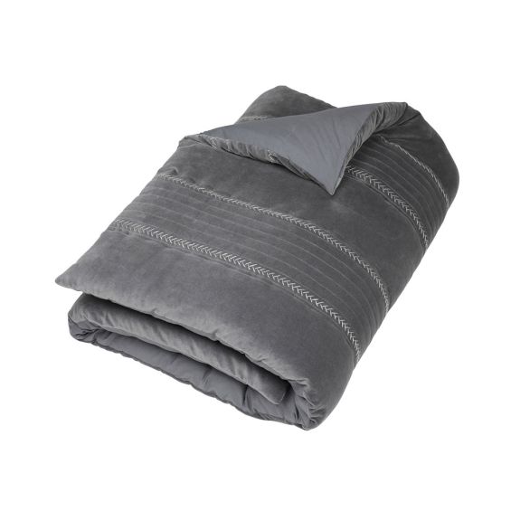 A luxurious grey velvet bedspread with handstitched details