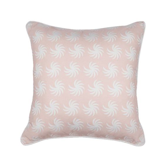 A pastel pink cushion with white piping and a palm-like pattern