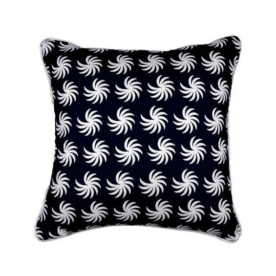 A dark blue square cushion with a white, palm-like design