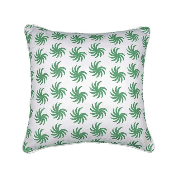 A square cushion with green palms and a white background