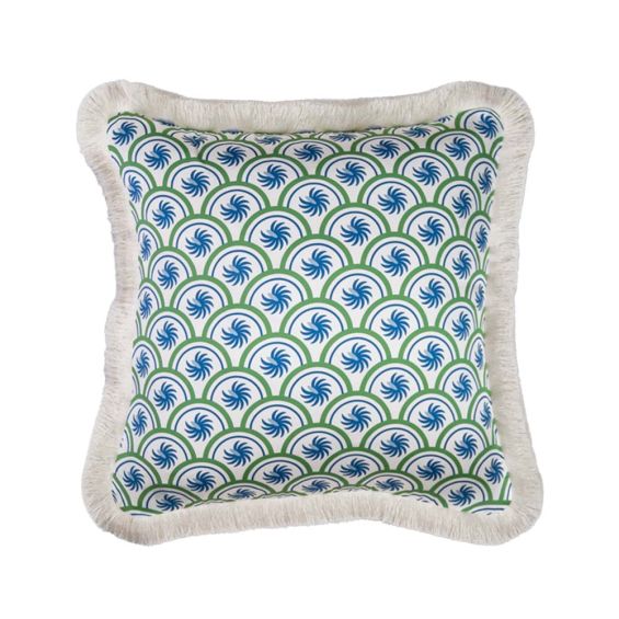 A glamorous art deco inspired cushion with green and blue patterns and a white fringe
