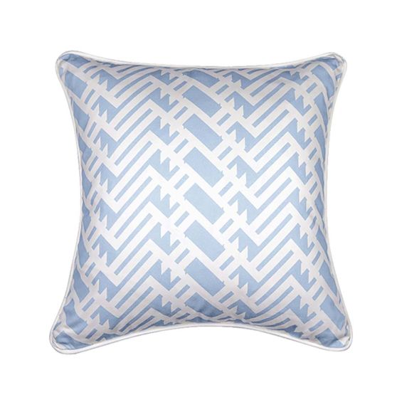 A light blue, lattice inspired cushion with matching white piping 