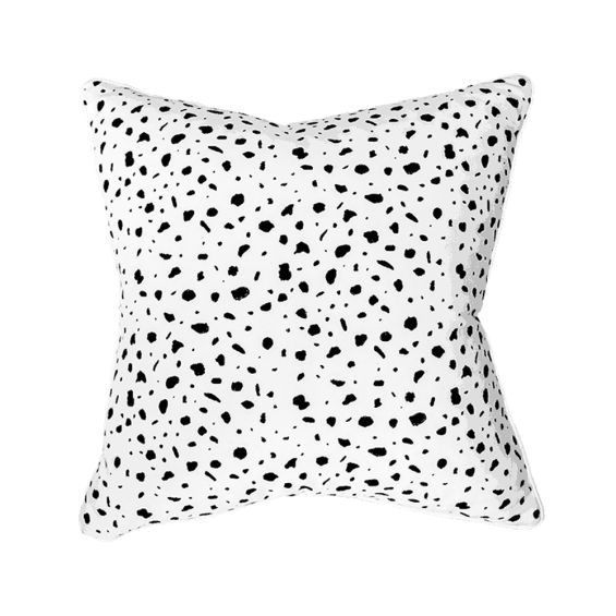 A luxurious white cushion with black speckles 