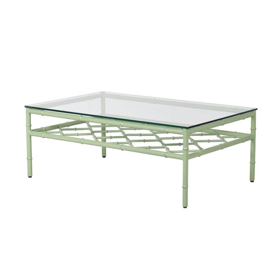 A stunning sage green coffee table with a transparent glass surface 