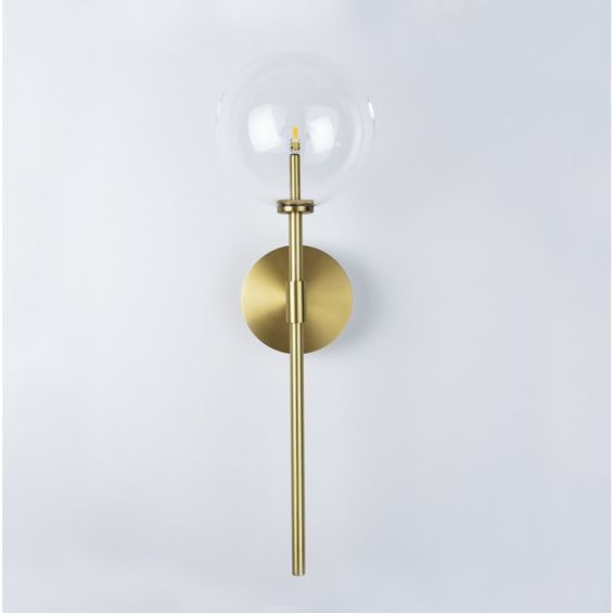 Contemporary natural brass wall lamp with large clear glass lampshade