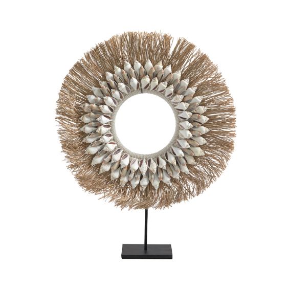 A fabulous coastal-inspired shell and raffia necklace on a metal stand