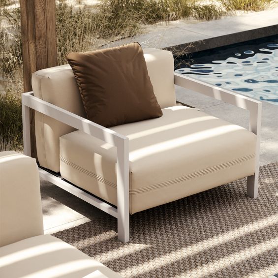 Modern outdoor armchair with steel frame and off white upholstery