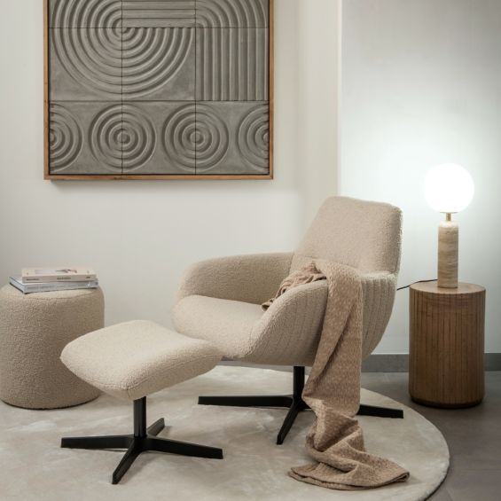 A comfortable lounge chair and footrest from Dome Deco with a luxury bespoke upholstery 