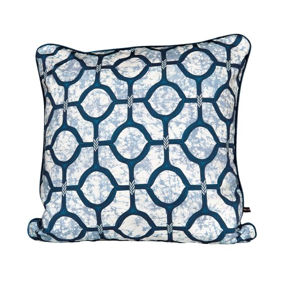 A luxury cushion by Eva Sonaike with a blue African-inspired pattern