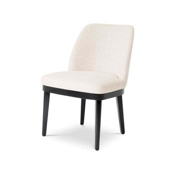 A stylish dining chair with a luxury Pausa Natural upholstery and sophisticated black frame