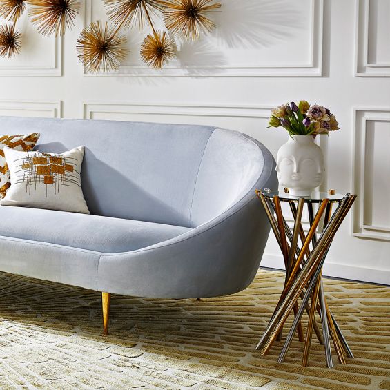 a glamorous nickel and brass table with a mirrored surface 