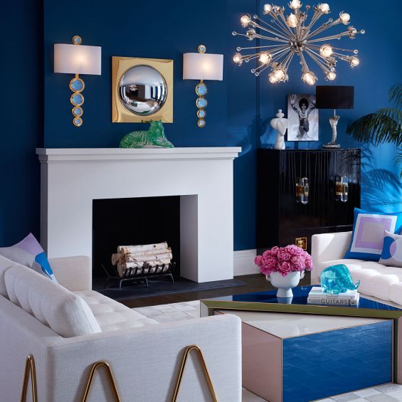 A luxurious brass wall lamps with blue acrylic cabochons  