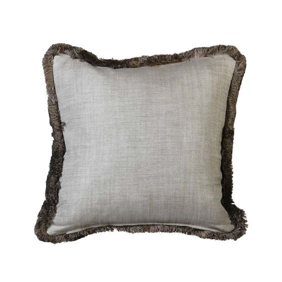 A delicate beige cushion with a complementary fringe