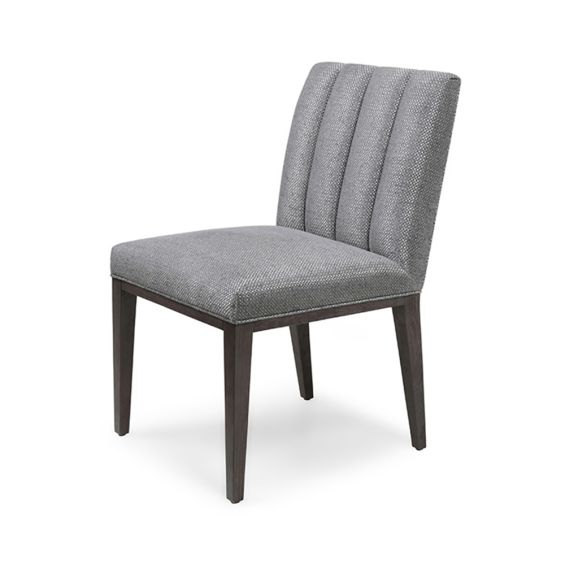 A stylish, contemporary dining chair with a fluted, upholstered back