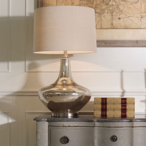 A luxurious side lamp with a crackle glaze finish and a natural linen shade