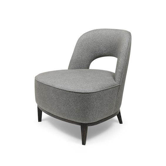 An elegant armchair with a sumptuous seat and backrest