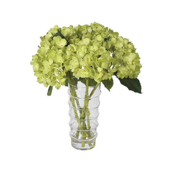 A beautiful, green hydrangea floral arrangement with a clear glass vase 