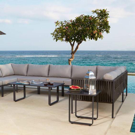 A luxury outdoor love seat from Willow's Outdoor collection with bespoke sunbrella upholstery