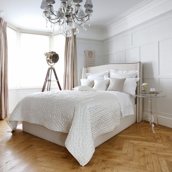 Luxury, French-style bed with small wings and French studding on a sprung slatted base