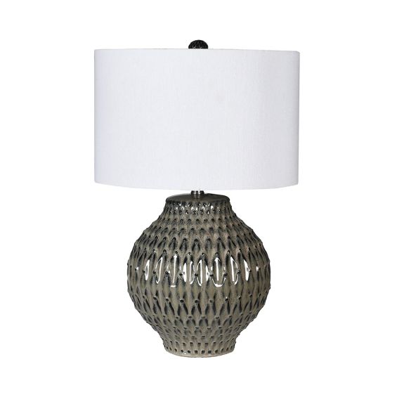 A stylish patterned lamp with a glaze finish and white linen shade