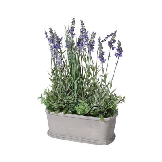 A beautiful realistic, faux lavender plant in an iron pot