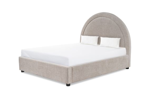 A stylish bed by Liang & Eimil with a gorgeous taupe upholstery and statement rounded headboard