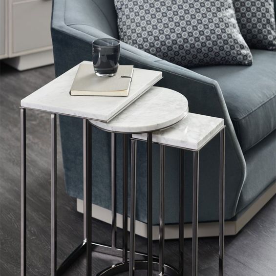 Luxurious stacked set of side tables with silver base and white marble surface