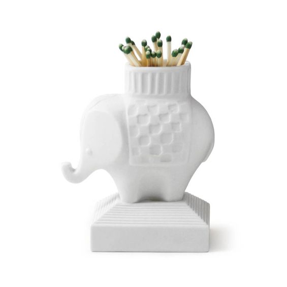 A luxurious, porcelain elephant match strike by Jonathan Adler 